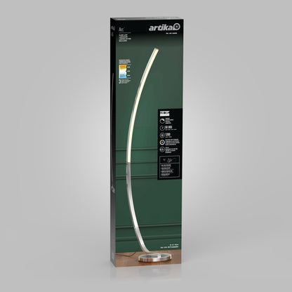 The Arc LED Floor Lamp by Artika, featuring a tall modern arched design with a silver finish, is shown on a green Artika box, highlighting its LED technology and dimmable lighting features on the front.