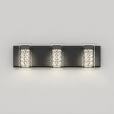 A modern wall-mounted light fixture with three rectangular lights, each encased in a clear, textured glass cover, attached to a sleek black rectangular base against a plain light-colored wall.
