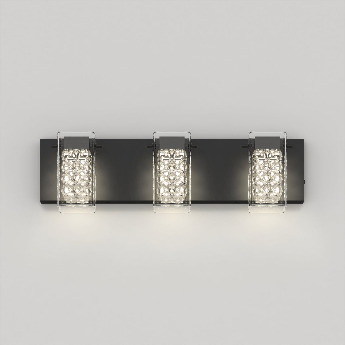 The Artika Crystal Cube LED bathroom vanity light 5 CCT is a modern black wall sconce featuring three textured rectangular crystal glass shades mounted on a flat black base against a light gray wall.
