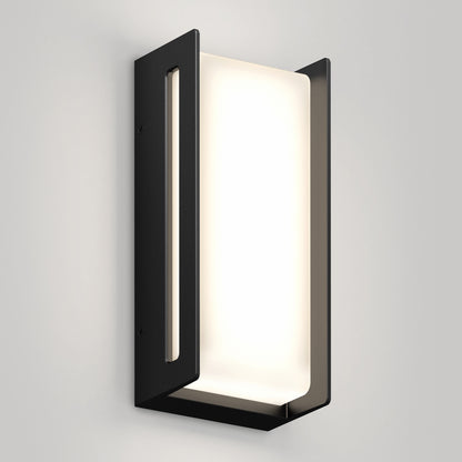 The Artika Ryker smart RGB indoor-outdoor wall light features a minimalist rectangular black metal frame and frosted white panel, shown mounted on a light gray wall—a modern, geometric design.