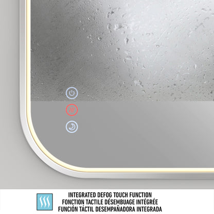 Close-up of a foggy mirror with illuminated touch buttons, including a red heating icon and blue power icon. Text below reads INTEGRATED DEFOG TOUCH FUNCTION in English, French, and Spanish.
