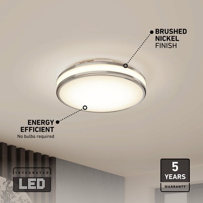 The Hemisphere 15 in. LED flush mount light by Artika is shown lit, featuring a modern round design and brushed nickel finish. It offers energy efficiency, adjustable brightness, 5 CCT options, integrated LED with no bulbs needed, plus a 5-year warranty—ideal for bathrooms.