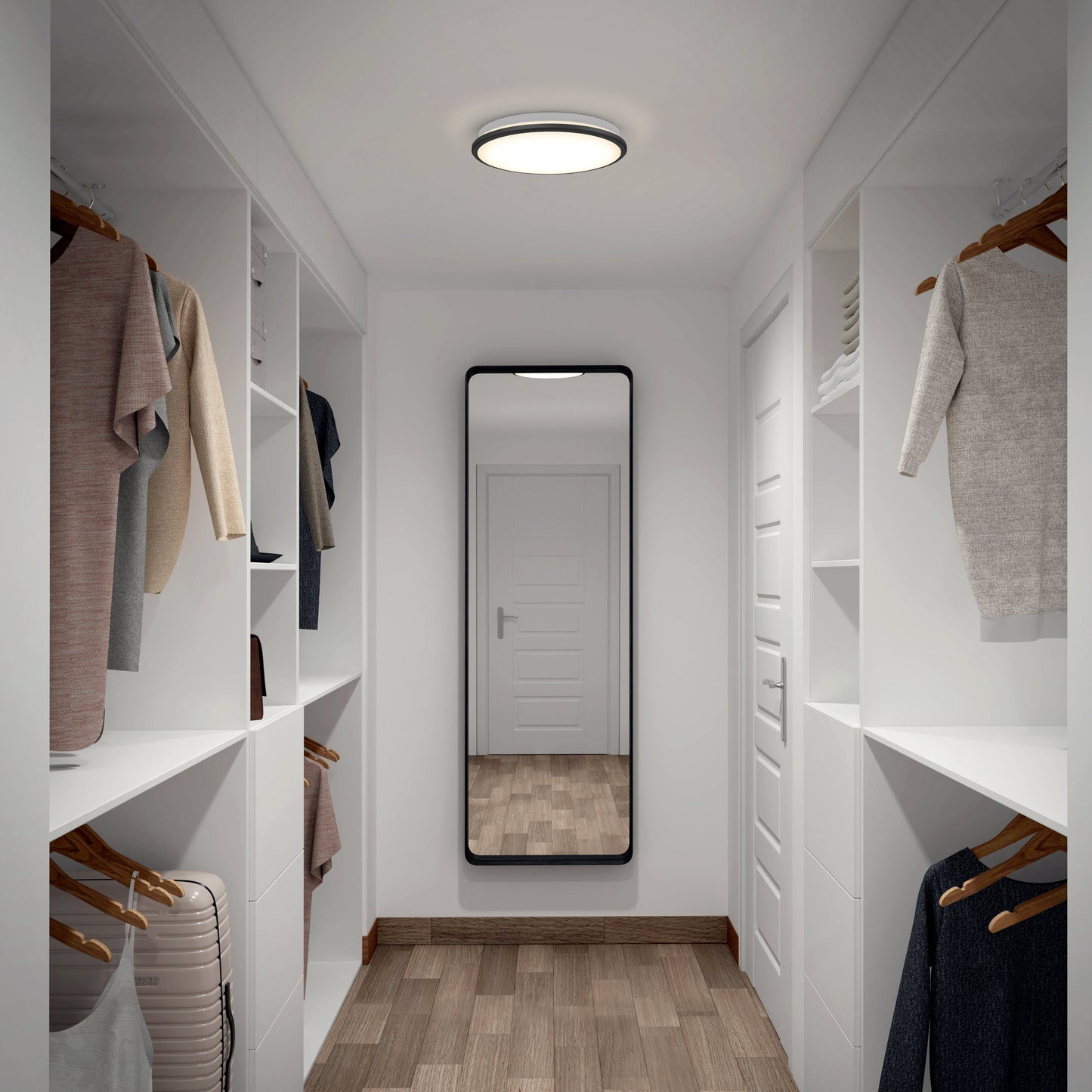 A modern walk-in closet with clothes on both sides, white shelves, wooden floor, large wall mirror at the end, and an Artika-CAN-dev Vera 13 in. LED modern flush mount light illuminating the space.