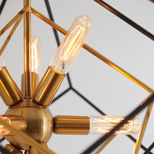 Close-up of the Artika Imperium 9-light chandelier with vintage bulbs and a geometric gold metal frame.