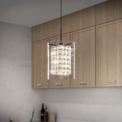 A modern kitchen with light wood cabinets showcases the Artika Crystal Cube 1-light LED pendant, featuring a cylindrical design and crystal-like details that illuminate the countertop below.