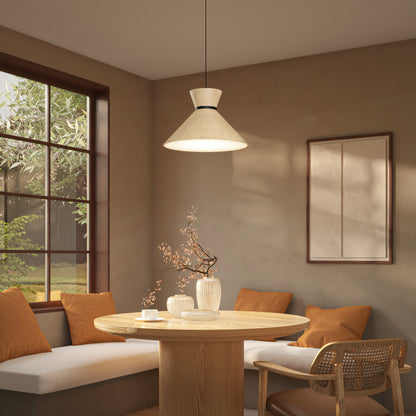 A cozy dining nook features a round wooden table, ceramic vases with branches, orange cushions on a built-in bench, a cane chair, a large window with greenery outside, and the Artika Inoa LED pendant light 5 CCT in black and wood overhead.