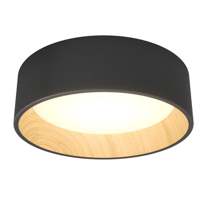 The Artika Alton LED flush mount features a modern design with a black outer rim, wood accent, and round glowing center—an elegant lighting choice.