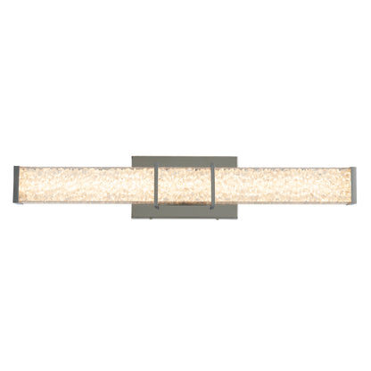 The Artika Royale LED bathroom vanity light features a modern, wall-mounted design with a rectangular base, a long textured crystal-like illuminated bar, and sleek metal accents on both ends and at the center.