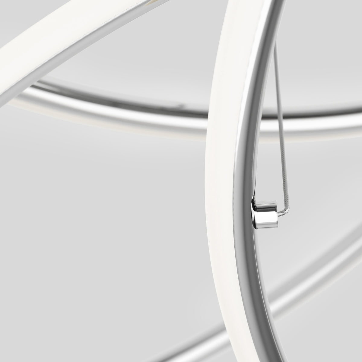 Close-up of the Swirl Butterfly LED contemporary pendant light by Artika, featuring intersecting smooth curved metal rods with a white and silver finish. The sleek, modern design stands out against a light grey background.