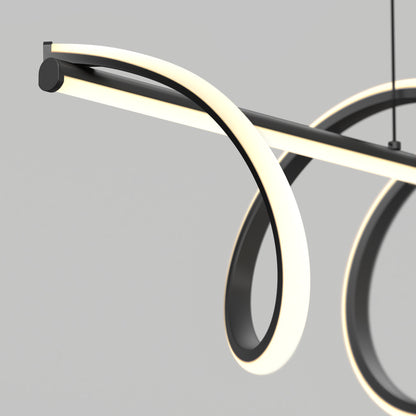 The Artika Coda modern LED pendant light 5 CCT features sleek black intertwining loops with glowing white edges, creating a contemporary look. Suspended against a plain gray background, it combines artistic curves and modern style.
