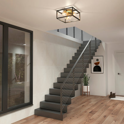 Modern entryway with a black metal staircase, cable railing, wood floors, potted plant, abstract wall art, large window, and the Artika Griffintown flush mount illuminating the space.