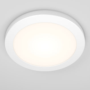 The Artika Europa Disk 7 in. LED modern flush mount light with 3 CCT emits a soft glow against a light gray ceiling in this round, white fixture.