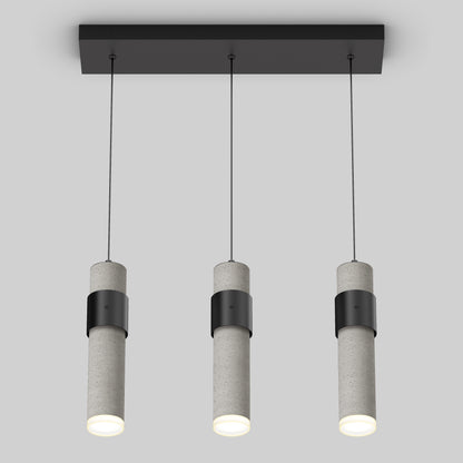 The Artika Barden 3-light LED pendant light features three cylindrical concrete pendants suspended from a rectangular black base, each casting a soft white glow.