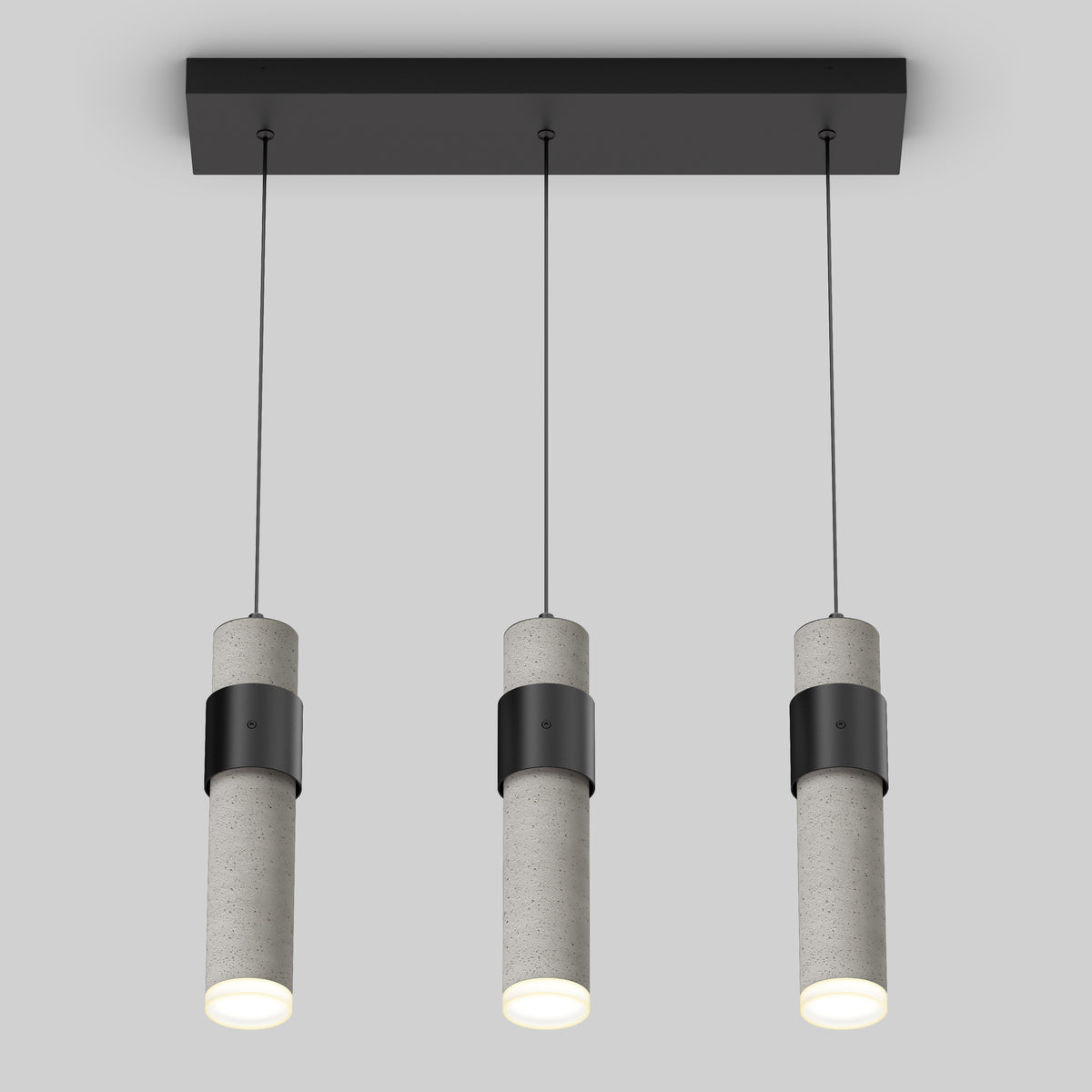 A modern ceiling light fixture with three cylindrical pendant lights hanging from a rectangular black base, each light has a concrete-like texture and emits a soft white glow.