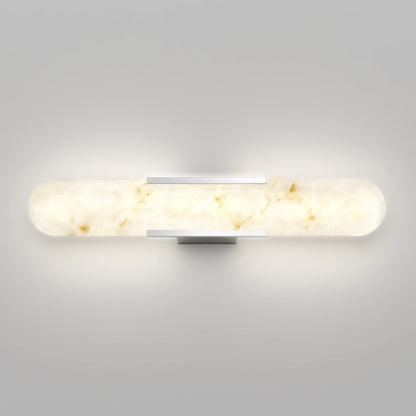 The Selena 3 CCT LED bathroom vanity light by Artika features a frosted cylindrical glass shade with marbled patterns, mounted on a sleek rectangular metallic base against a plain gray wall.