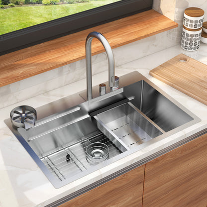 The Artika Neoflow single bowl stainless steel sink features a tall faucet, drying rack, vegetable washing area, and sits in a wooden countertop beneath a window with a cutting board and containers nearby.