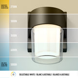 A wall-mounted light fixture is shown with its light color temperature ranging from warm white (2700K) to cool white (5000K), displayed in horizontal bands. The caption reads: Selectable White / Blanc Ajustable / Blanco Ajustable.