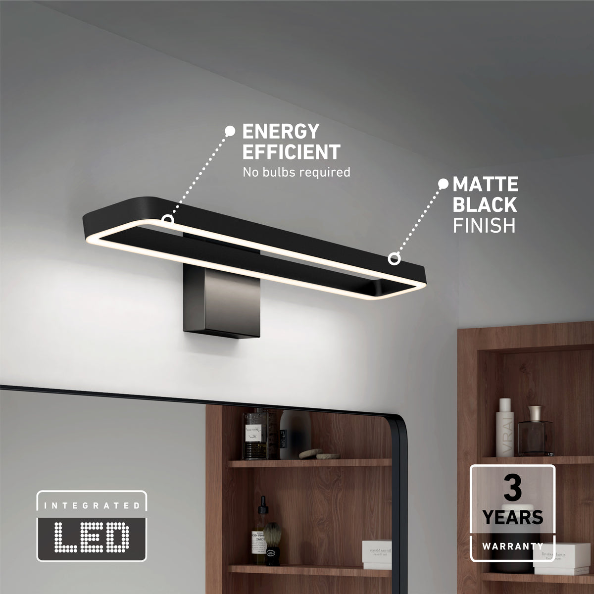 Modern rectangular LED wall light with a matte black finish mounted above a bathroom mirror; features include energy efficiency, no bulbs required, and a 3-year warranty. Shelves with towels and items are visible in the background.