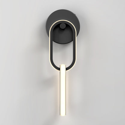 The Artika Catena modern LED wall sconce 5 CCT features a circular black base, an elongated oval frame, and a central vertical LED light bar, shown mounted on a plain light gray wall.