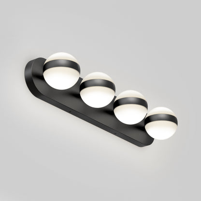 The Artika Baldric LED modern bathroom vanity light 3 CCT features four round frosted glass globes, each partially wrapped with a black band, mounted on a sleek black rectangular base against a light gray background.