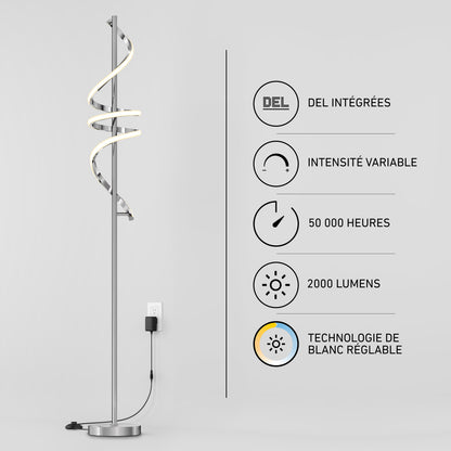 The Artika Coda modern LED floor lamp 5CCT stands by a wall featuring icons and French text about its integrated LEDs, adjustable white (5 CCT), 50,000-hour lifespan, 2000 lumens brightness, dimmable function, and minimalist design.