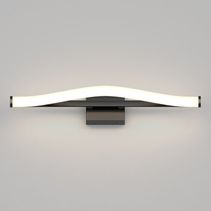 The Artika Arc modern LED bathroom vanity light 5 CCT features a black base with a sleek, gently curved white light bar, casting a soft glow on a plain gray wall.