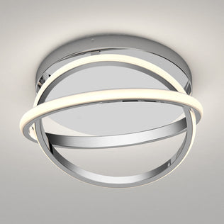 The Artika Orbia modern LED flush mount light 3 CCT features a circular chrome base with two intertwined rings—one illuminated, one reflective—creating a striking centerpiece when mounted on a white ceiling.