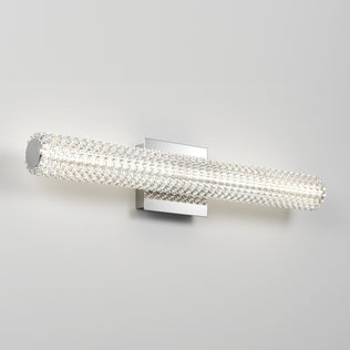 The Artika Exalto modern LED bathroom vanity light features a crystal-textured cylinder and metallic base—ideal for mirror lighting.