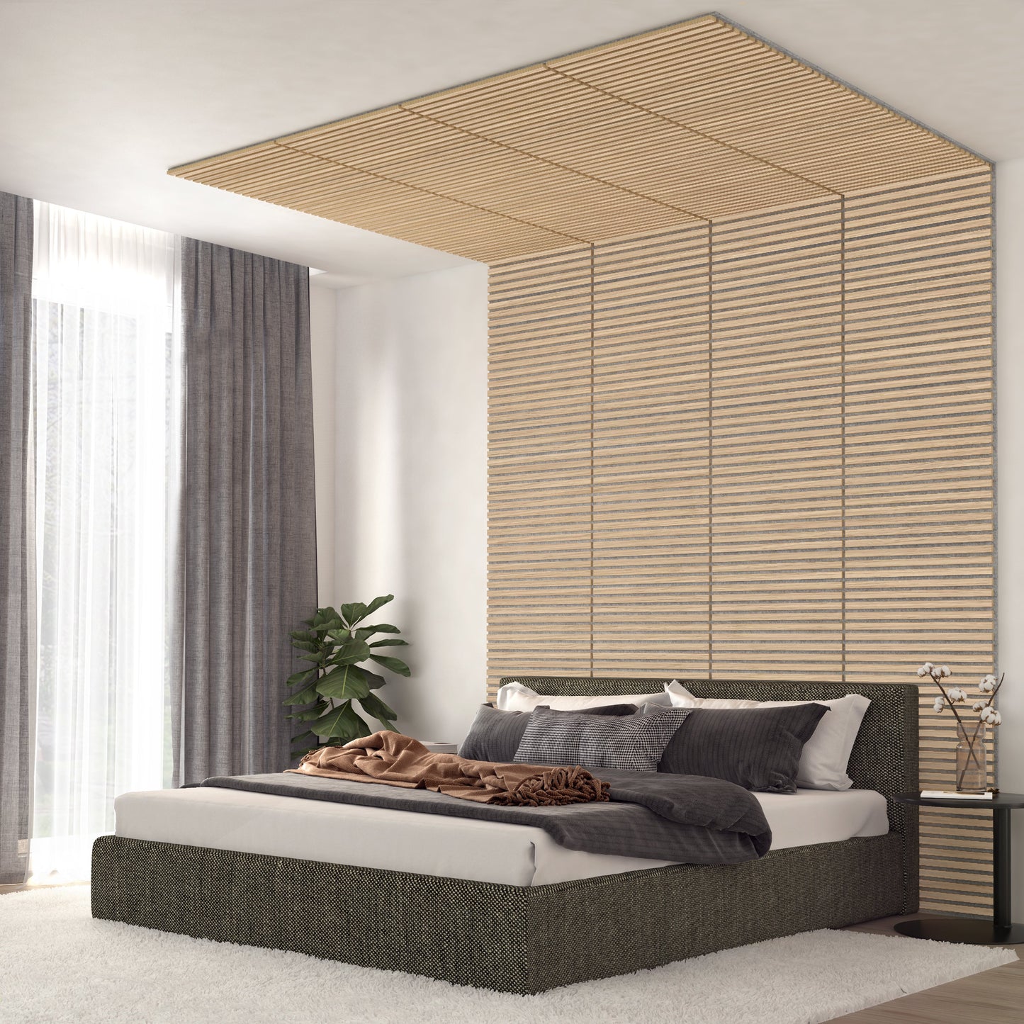 A modern bedroom features a low platform bed, neutral bedding, and an Artika-CAN-dev Sonolok 15.5 ft sound-absorbing wall panel kit extending to the ceiling. Grey curtains frame tall windows, with a potted plant in the corner for greenery.