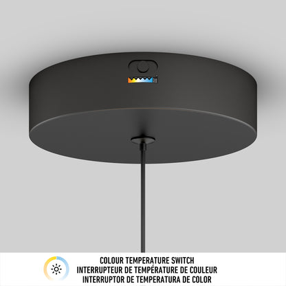 The Artika Inoa LED pendant light 5 CCT in black and wood features a color temperature switch with colored indicators, plus an English, French, and Spanish label stating Colour Temperature Switch.