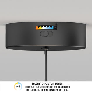 A close-up of the Artika Benson Mini LED pendant light 5 CCT, featuring an adjustable color temperature switch, is shown mounted on a white ceiling. Text below describes the switch in English, French, and Spanish.