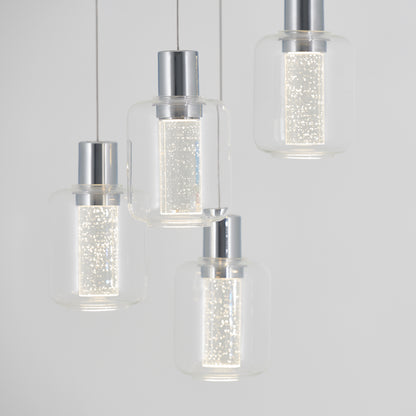 The Artika Champagne Globe 4-light LED pendant features modern metallic-topped clear glass shades hanging at varied heights, each emitting a sparkling, textured glow that softly illuminates any space.