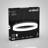 A black product box displaying the Artika Optical LED pendant light, shown as a modern, circular hanging fixture. The box highlights features like dimmability, 50,000-hour lifespan, 3 color options, and 1500 lumens.