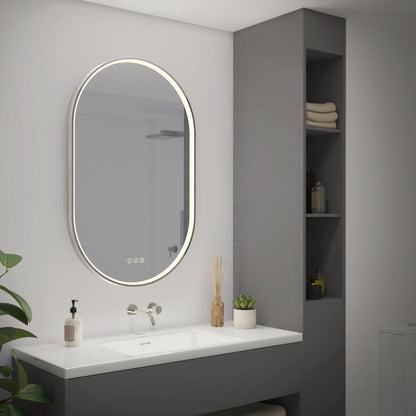 Modern bathroom featuring the Artika Royce LED mirror 3 CCT with defogger above a white sink, sleek gray vanity, open shelving for towels and toiletries, a potted plant, and minimalistic decor.