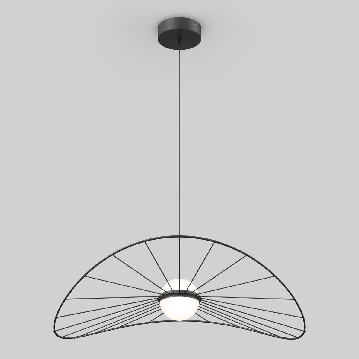 A modern pendant light with a black wireframe shade resembling a half umbrella or fan, suspended from the ceiling by a thin black cord; a round white bulb sits at the center.