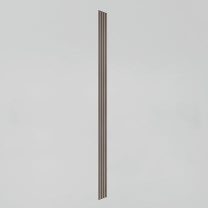 A single, tall, narrow vertical object with a ribbed or grooved texture, set against a plain light gray background.