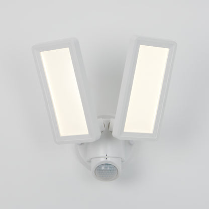 The Artika Sentinel outdoor Flat Panel Security light features two rectangular LED panels and a motion sensor below, all in a sleek white housing mounted on a white wall.