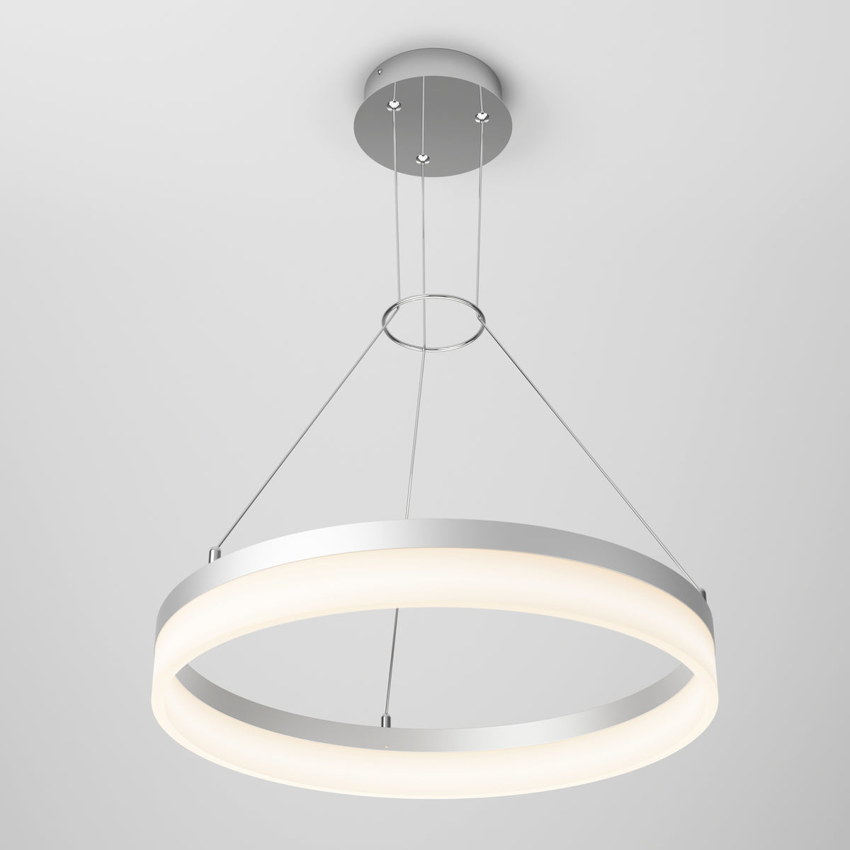 The Artika Optical LED pendant light 3 CCT features a modern circular design with a metallic frame, suspended by three thin wires from a plain, light gray ceiling, emitting a soft, even glow.