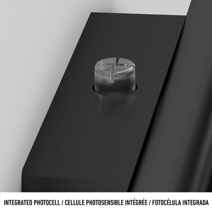 Close-up of a round, clear integrated photocell on the sleek black Bowen modern LED outdoor address wall light 5 CCT by Artika. Text below reads: INTEGRATED PHOTOCELL / CELLULE PHOTOSENSIBLE INTÉGRÉE / FOTOCÉLULA INTEGRADA.