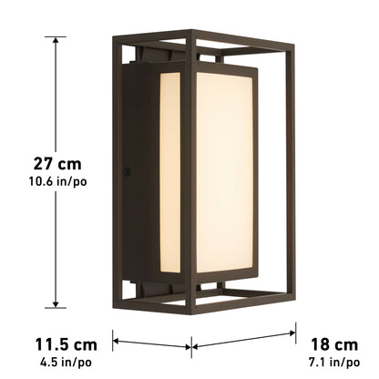 The Artika Ghost indoor-outdoor LED wall light has a geometric dark bronze metal frame, measuring 27 cm tall, 11.5 cm wide, and 18 cm deep. Its frosted inner panel diffuses light for a sleek rectangular design.