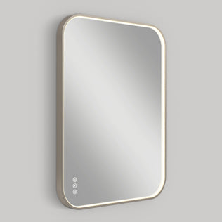 The Artika Royce Dimmable LED Mirror features a rectangular shape with rounded corners, a slim illuminated edge, and three circular touch buttons for defogging and 3 CCT adjustment, shown on a plain gray background.