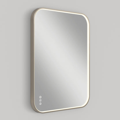 The Artika Royce Dimmable LED Mirror features a modern rectangular design with rounded corners, thin frame, adjustable 3 CCT lighting, and three touch buttons on the lower left. It is mounted horizontally or vertically on a plain, light-colored wall.