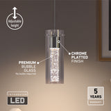A modern pendant light with a cylindrical glass shade featuring bubble glass and a chrome-plated finish. It hangs from the ceiling with adjustable height and includes an integrated LED. A 5 years warranty label is shown.