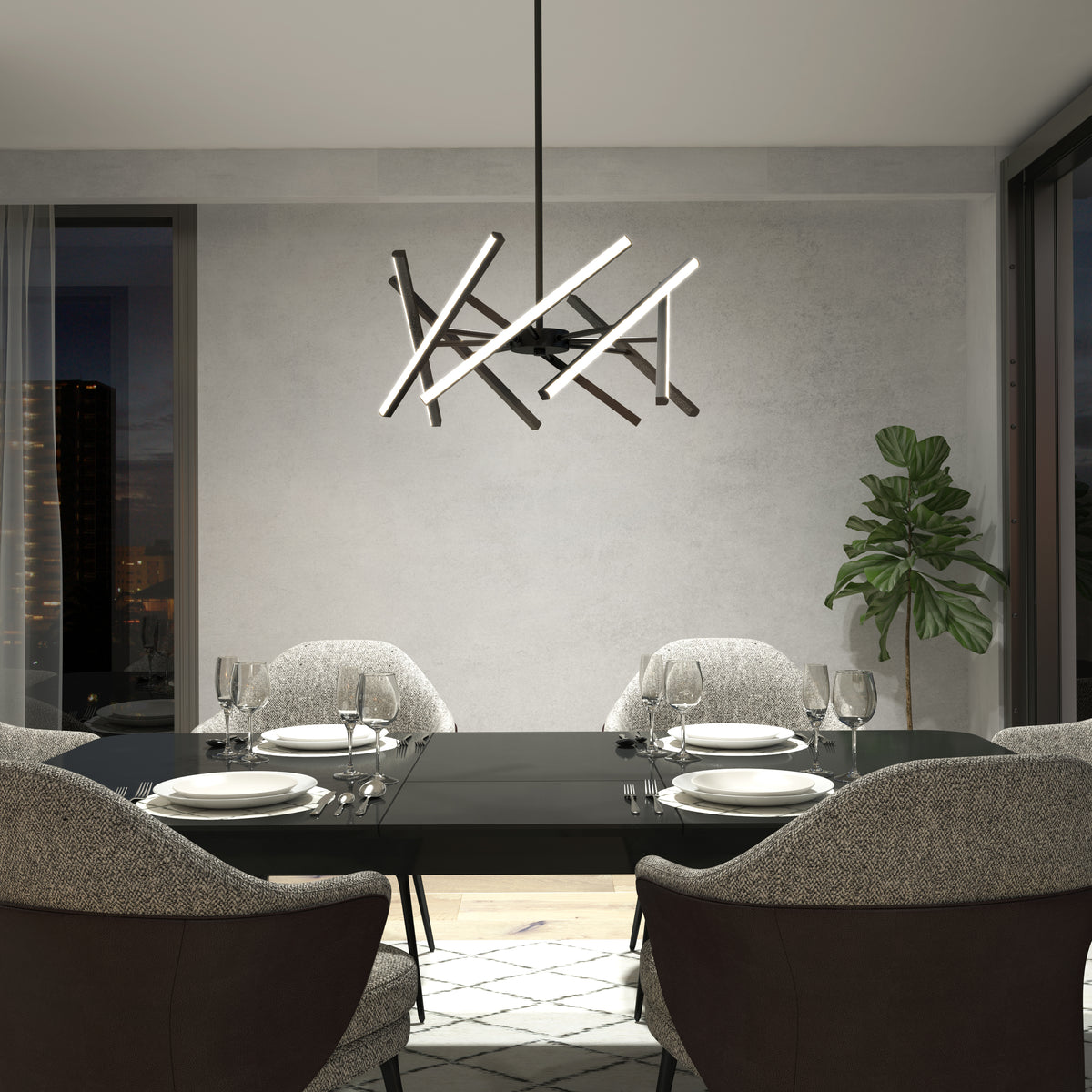 A modern dining room with a black table set for four, cushioned gray chairs, a geometric chandelier, a potted plant, large windows, and neutral-colored walls.