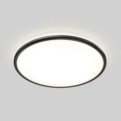 The Artika Macy 15 in. LED modern flush mount light features a black trim and bright white glow, shown flush-mounted against a plain light gray background. This RGB Wifi-enabled ceiling fixture blends contemporary style with smart technology.