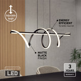 Modern pendant light with a matte black finish hangs over a dining table. The LED fixture is looped in a stylish design. Text highlights its adjustable height, energy efficiency, integrated LED, and 3-year warranty.