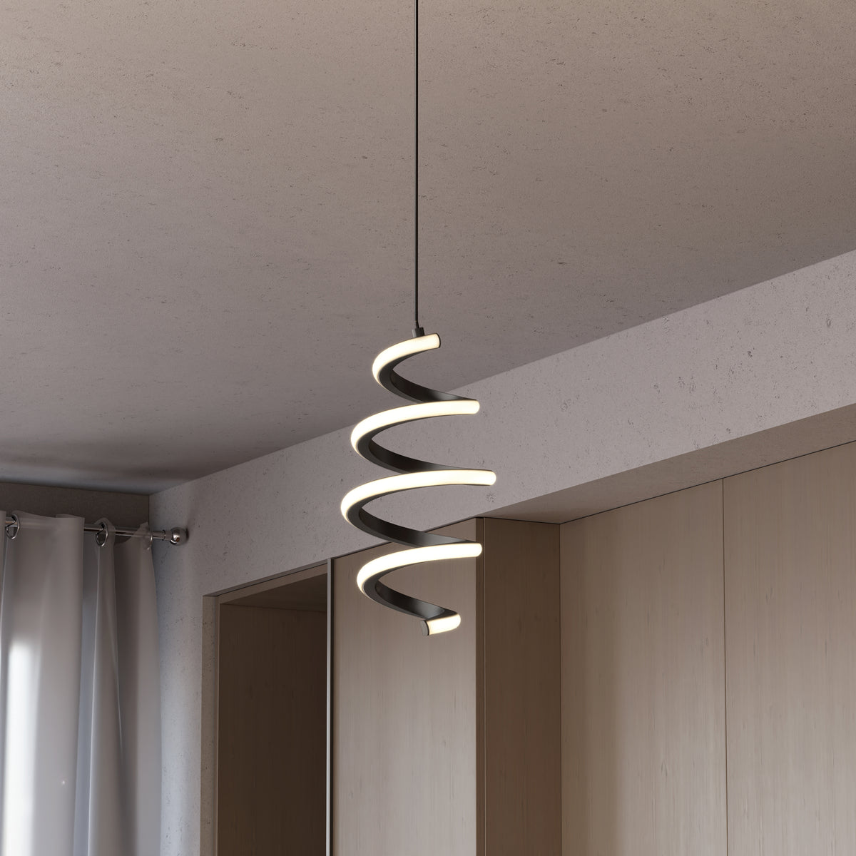 The Artika Chorus 1-light LED pendant 5 CCT hangs from the ceiling in a minimalist room with light wood cabinets and white curtains.