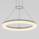 A modern circular pendant light with a glowing ring, suspended from the ceiling by three thin cables, against a plain light gray background.
