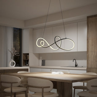 Modern kitchen and dining area featuring a wooden table, beige cushioned chairs, minimalist white cabinets, a black faucet, and the Siena modern LED pendant light by Artika hanging above the table.