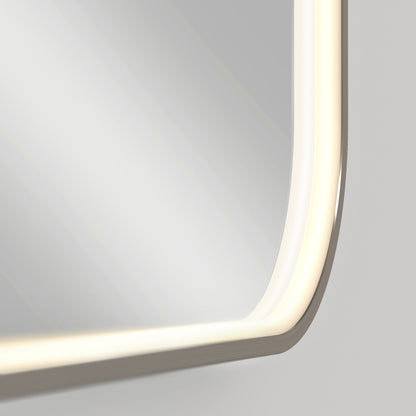 Close-up of the Artika Royce Dimmable LED Mirror (3 CCT), mounted horizontally, showcases its rounded edges and built-in adjustable LED strip, casting a soft glow against a neutral wall.